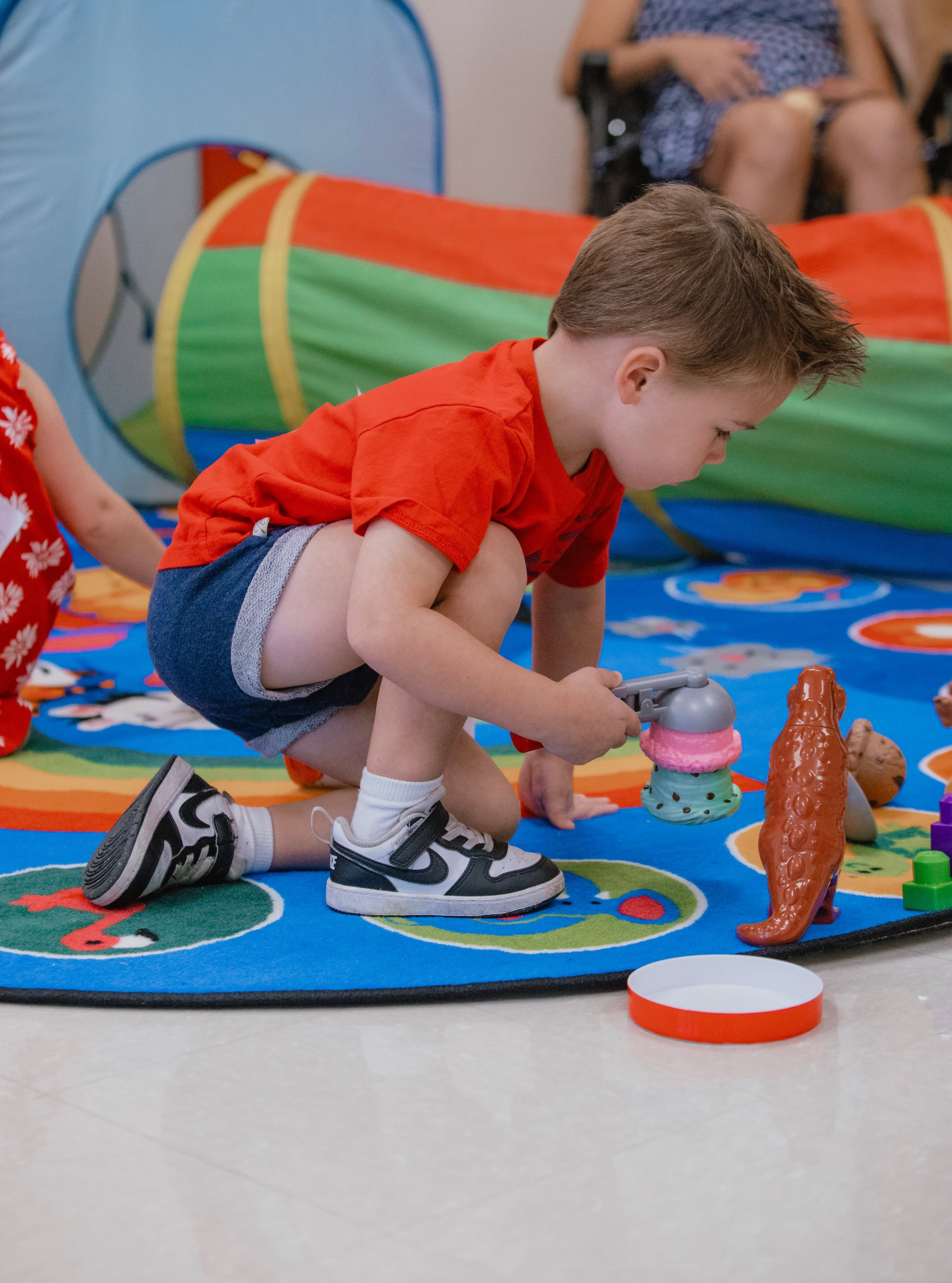 A child exploring colorful toys in Kid Life